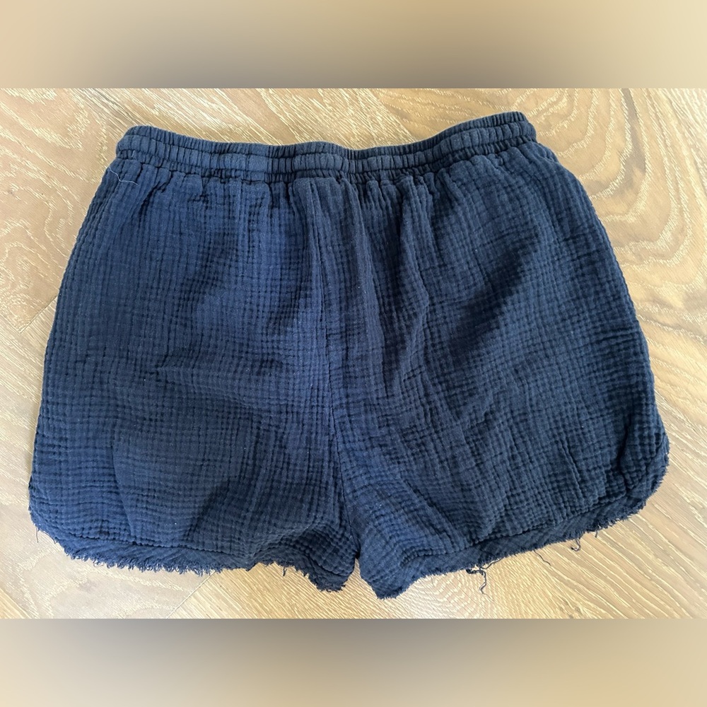 Size small dark blue shorts, pull on, drawstring to tighten. Pockets. Unlined